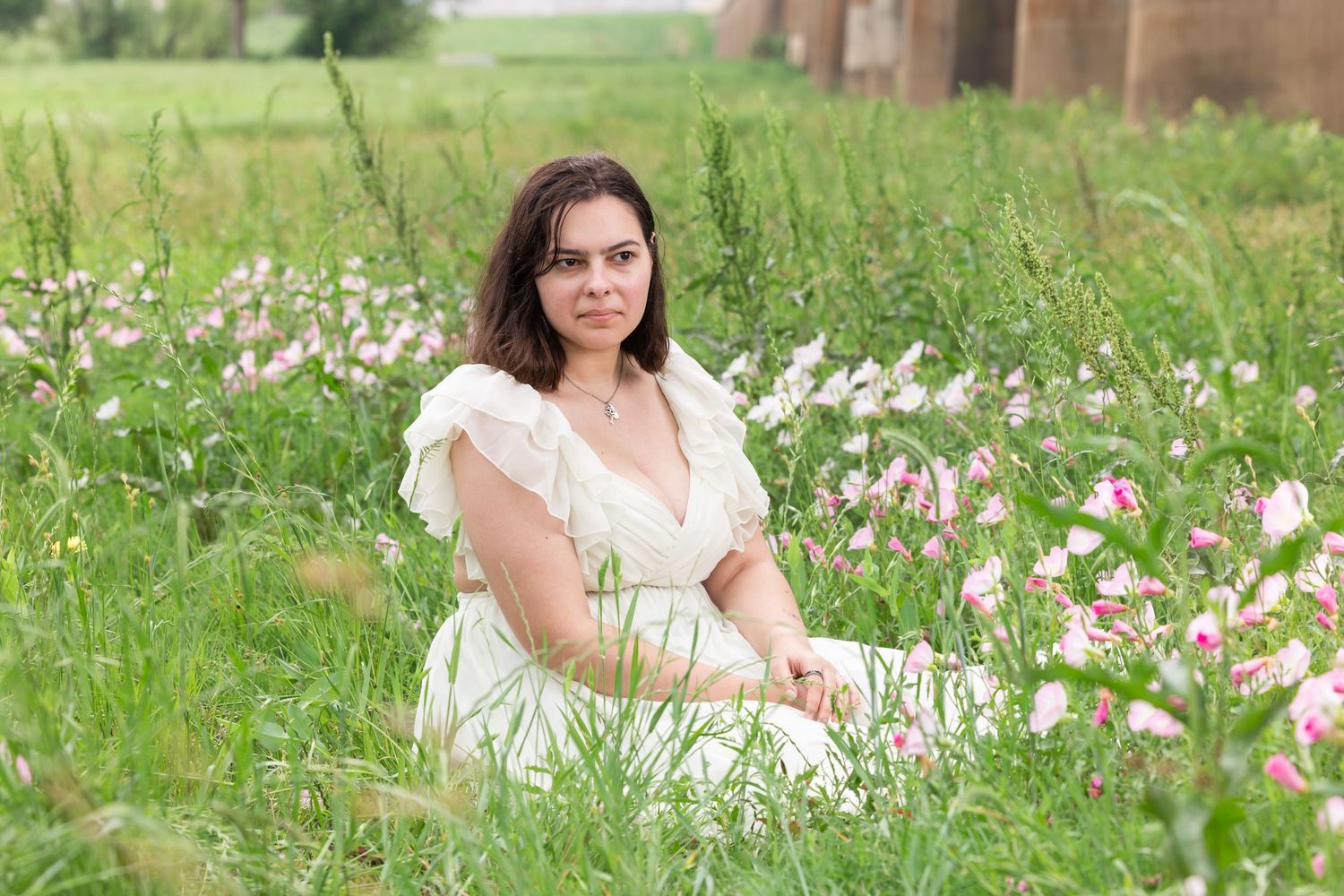 sitting in a flower field