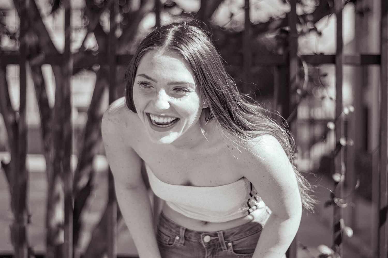 young woman laughing and posing