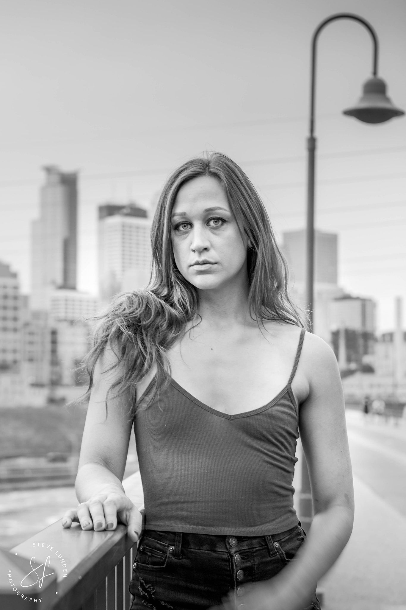 young woman with minneapolis in background