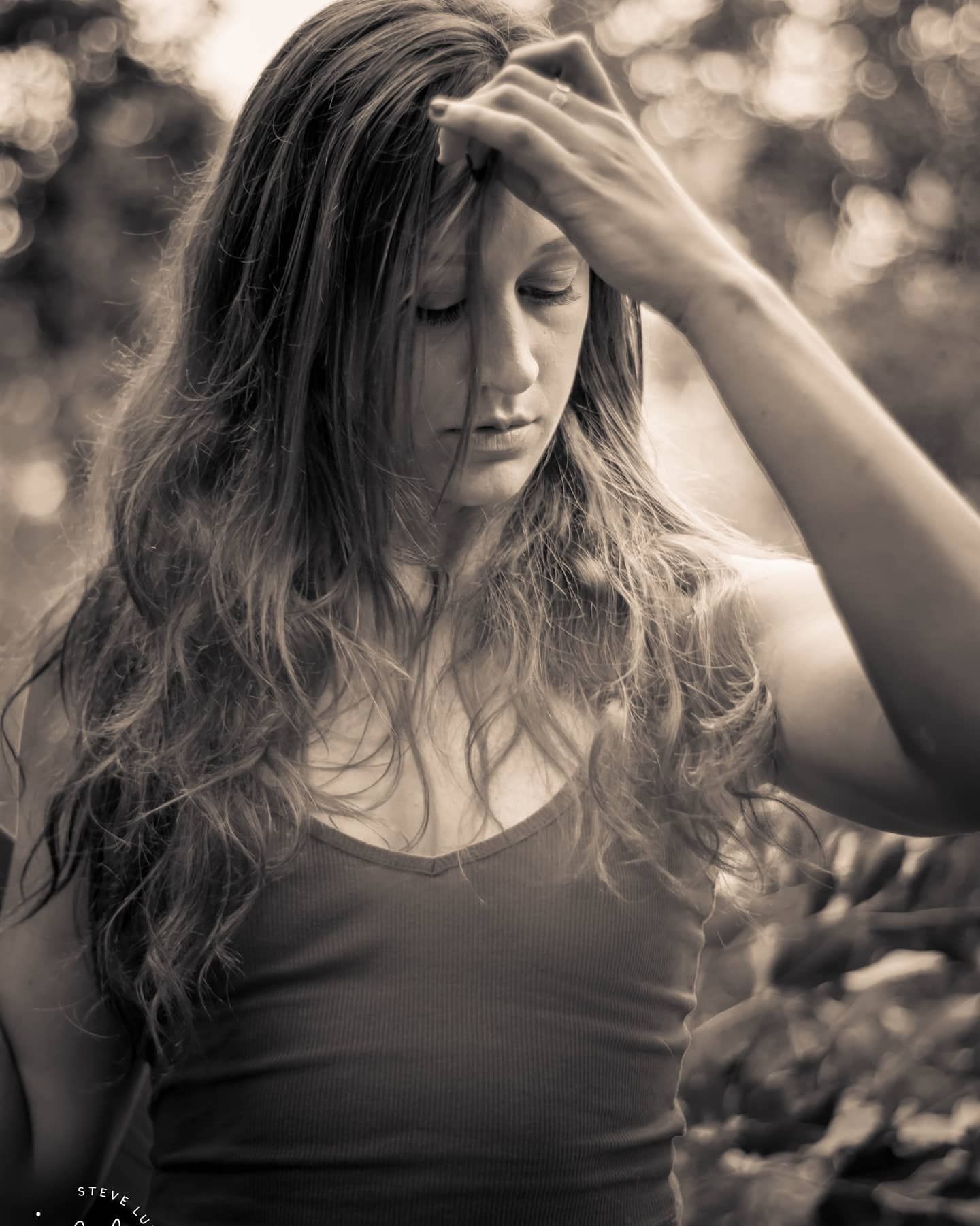 young woman running hand through hair