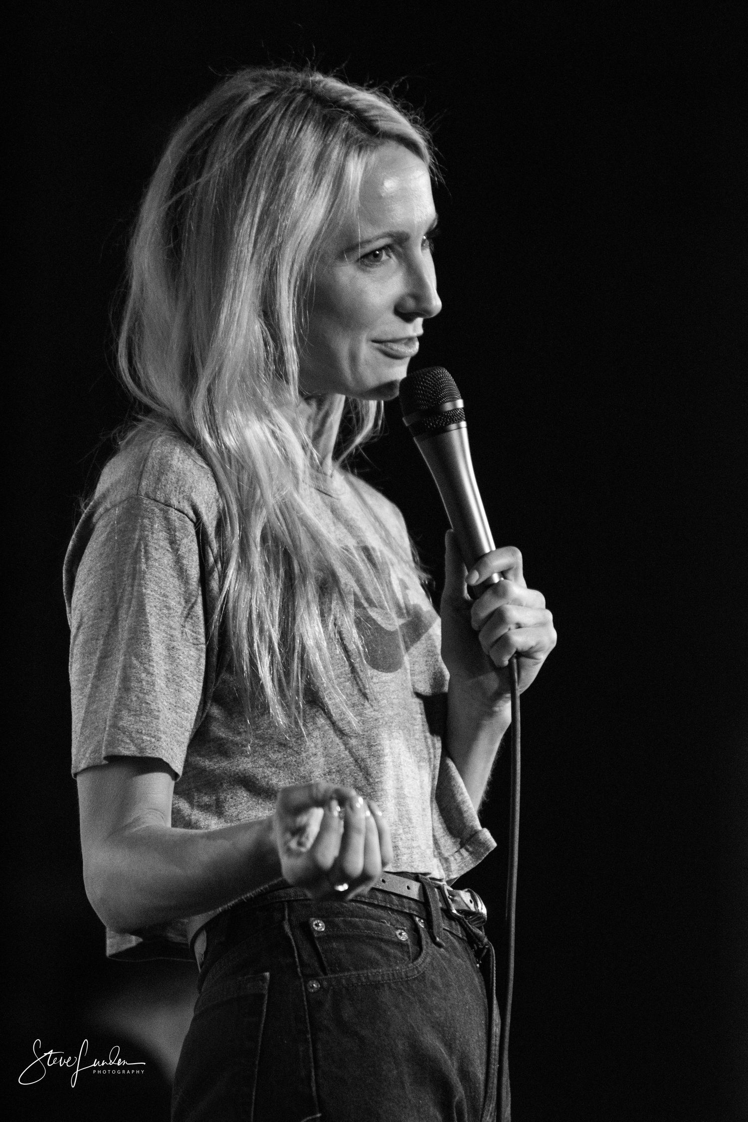 balck and white of female comedian on stage