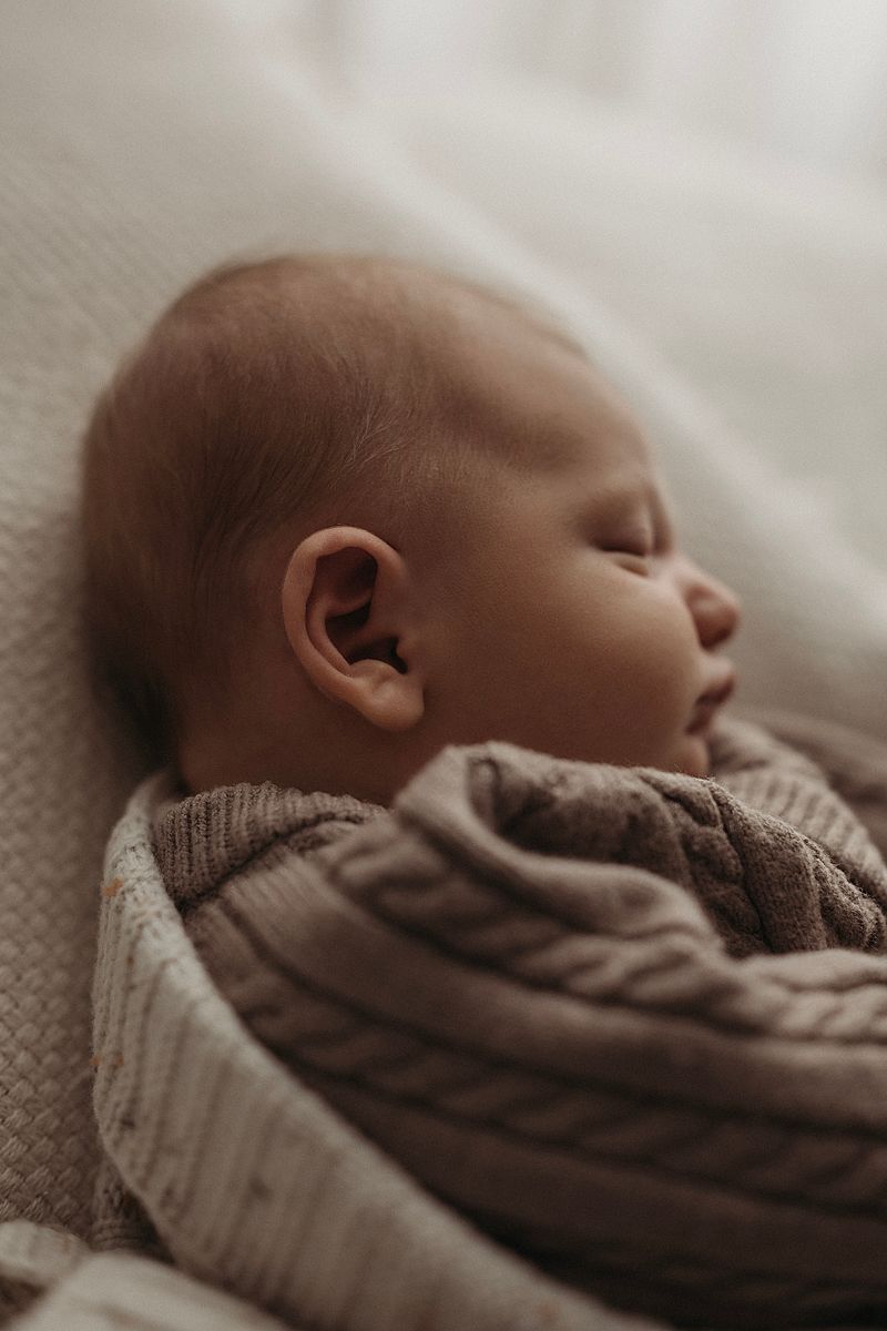 baby wrapped in soft fabric newborn session  geelong