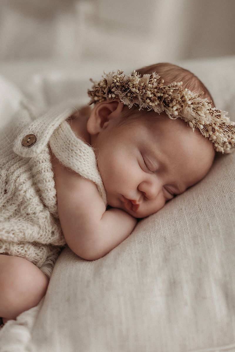 6 week old baby asleep in a knit romper having a photoshoot in geelong