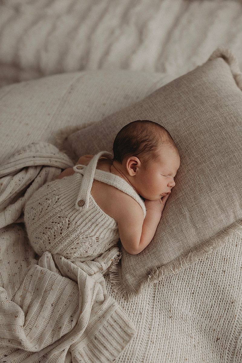 newborn-asleep-in-knit-romper-armstrong-creek-newborn-photography-studio