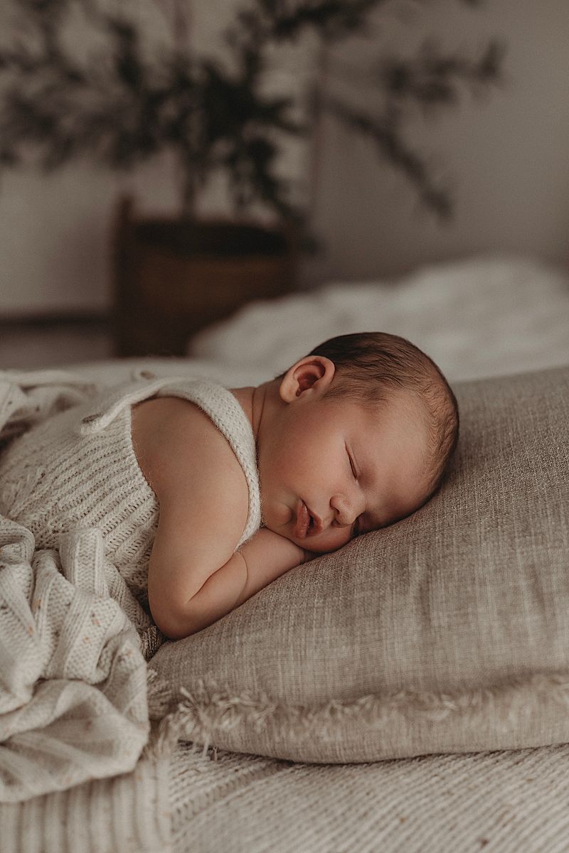 newborn-asleep-in-knit-romper-armstrong-creek-newborn-photography-studio