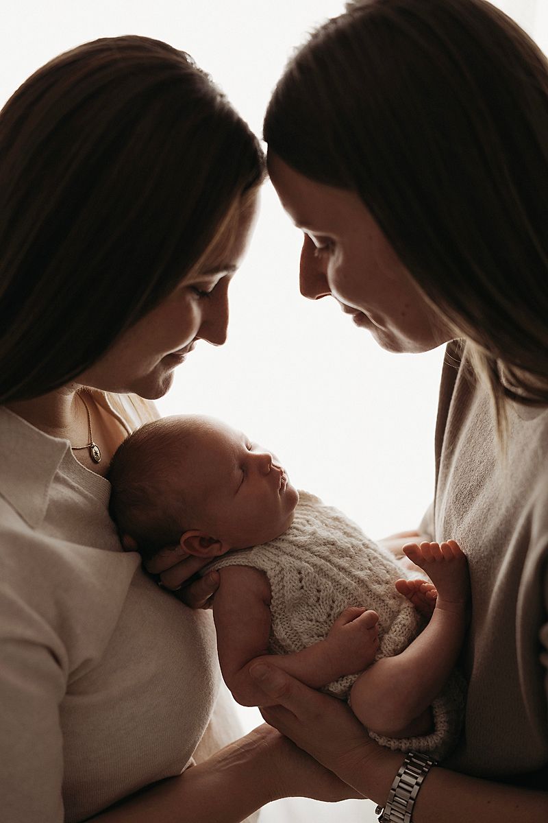 two mums holding their new baby surf coast and Geelong photographer