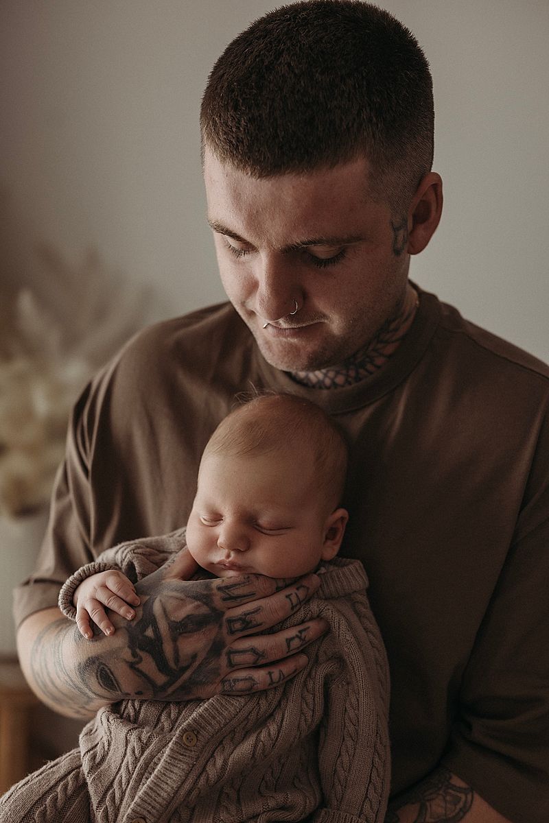 dad holding newborn baby portrait geelong studio session