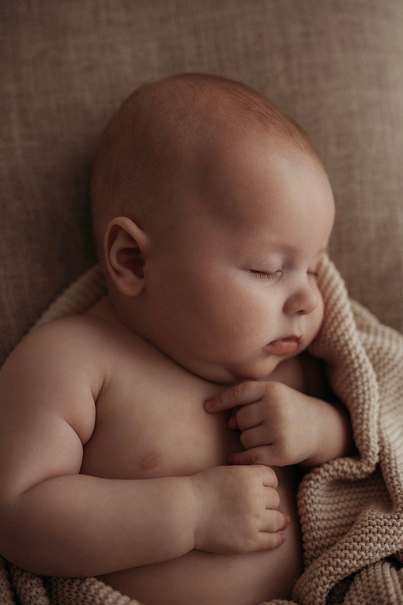 Close-up macro photograph of a baby’s tiny fingers during a family photography session in Geelong