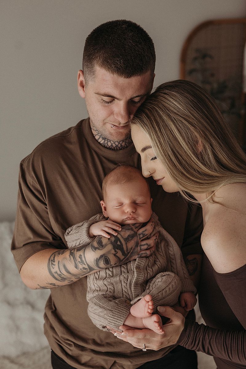 mother kissing newborn baby head geelong photography session