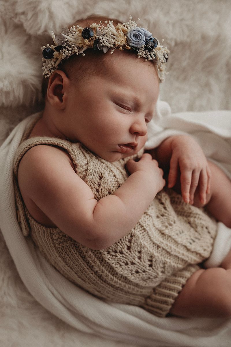 newborn girl sleeping in floral headband geelong newborn photographer near me