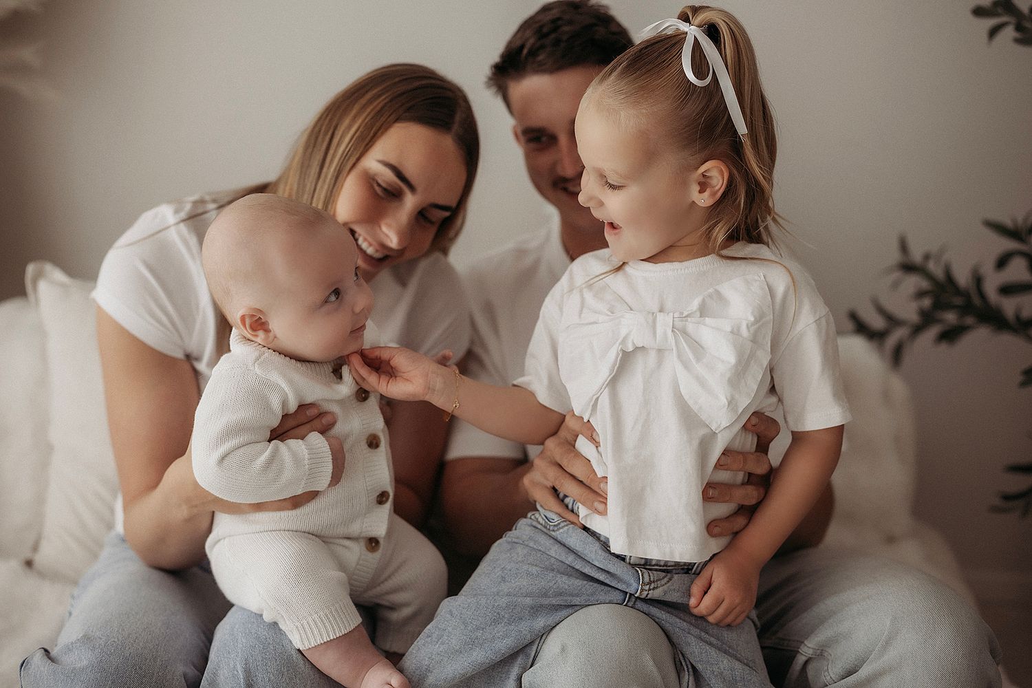 Family sharing cuddles and genuine connection during a relaxed family photography session in Geelong.