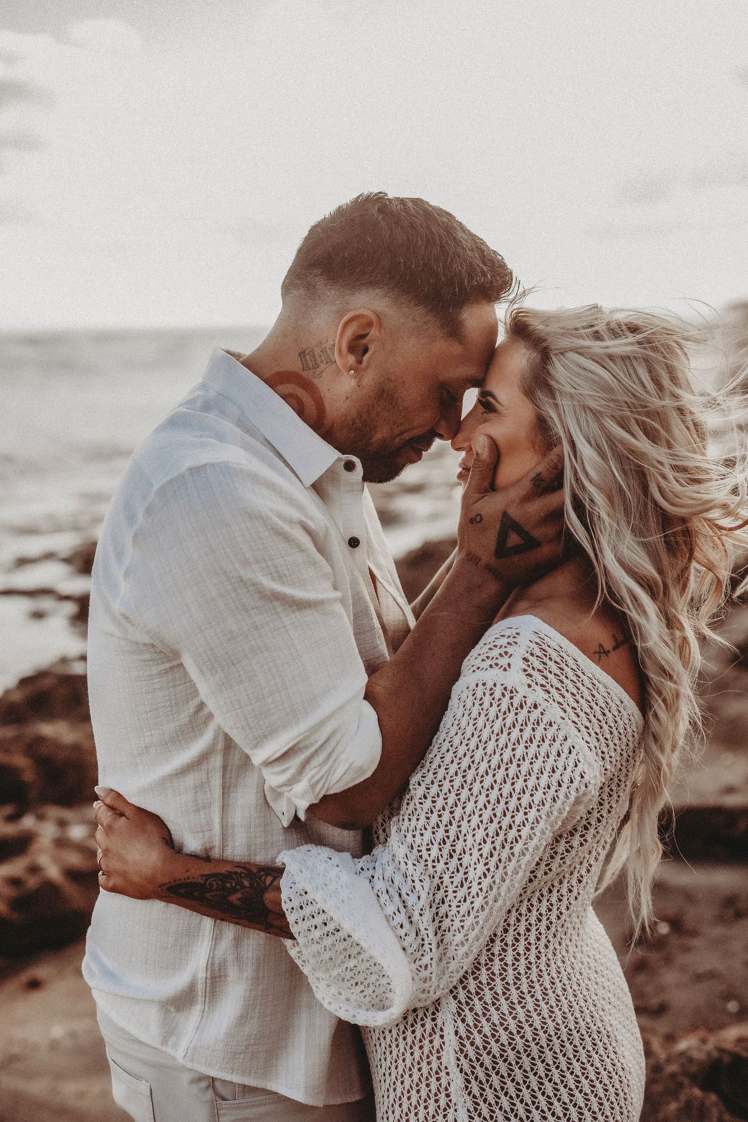young beautiful couple posing on the beach for engagement session geelong torquay