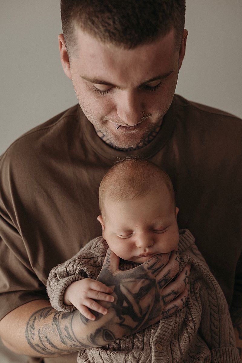 father holding newborn baby close geelong photography
