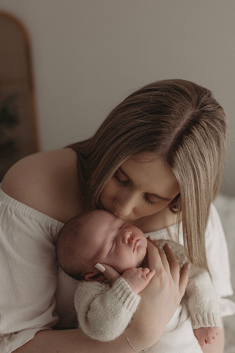 parents-holding-new-baby-girl-in-geelong-photographer-studio