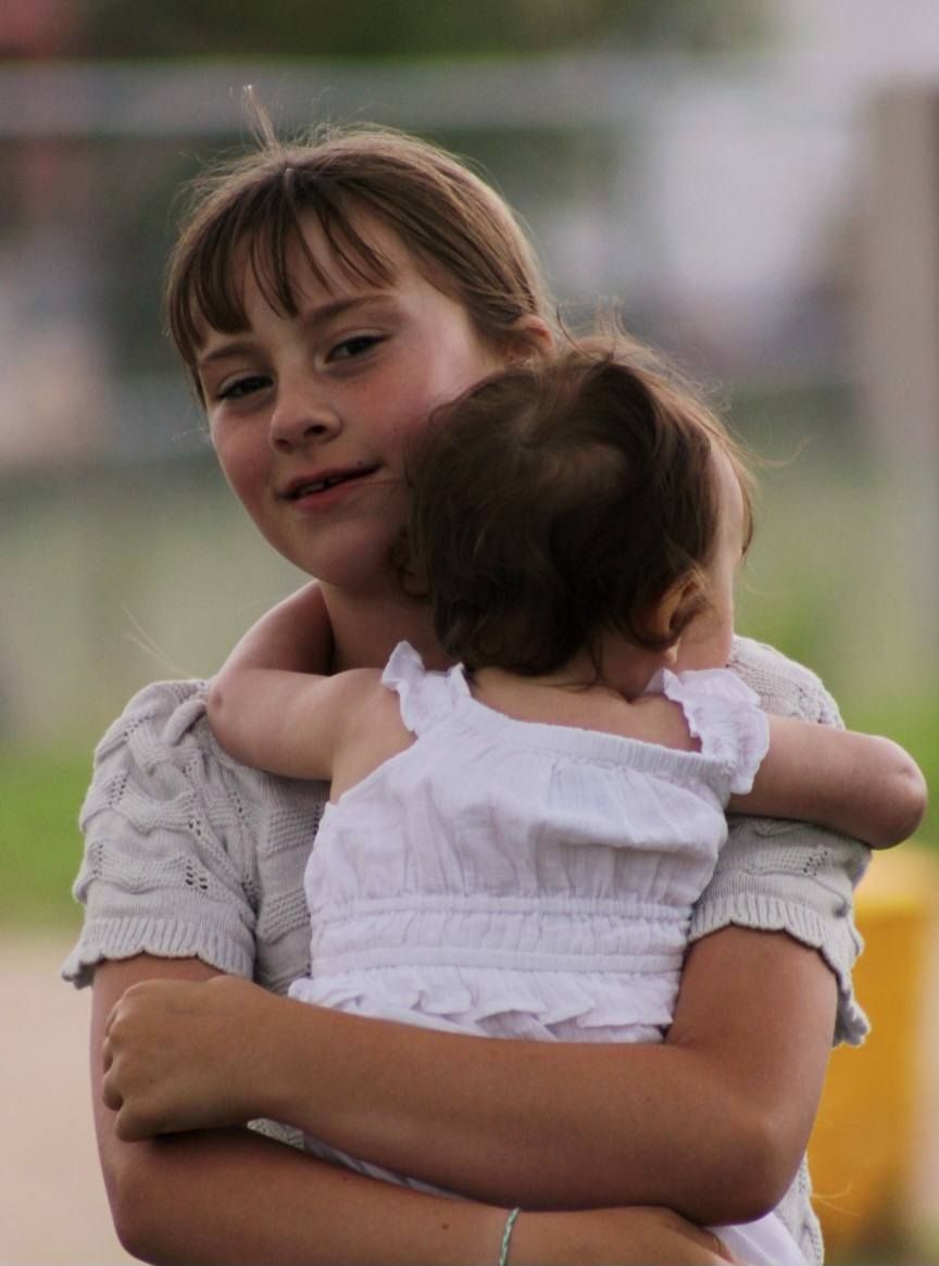 Portrait of girl and baby springtime, Headid Park, Sioux City, Iowa