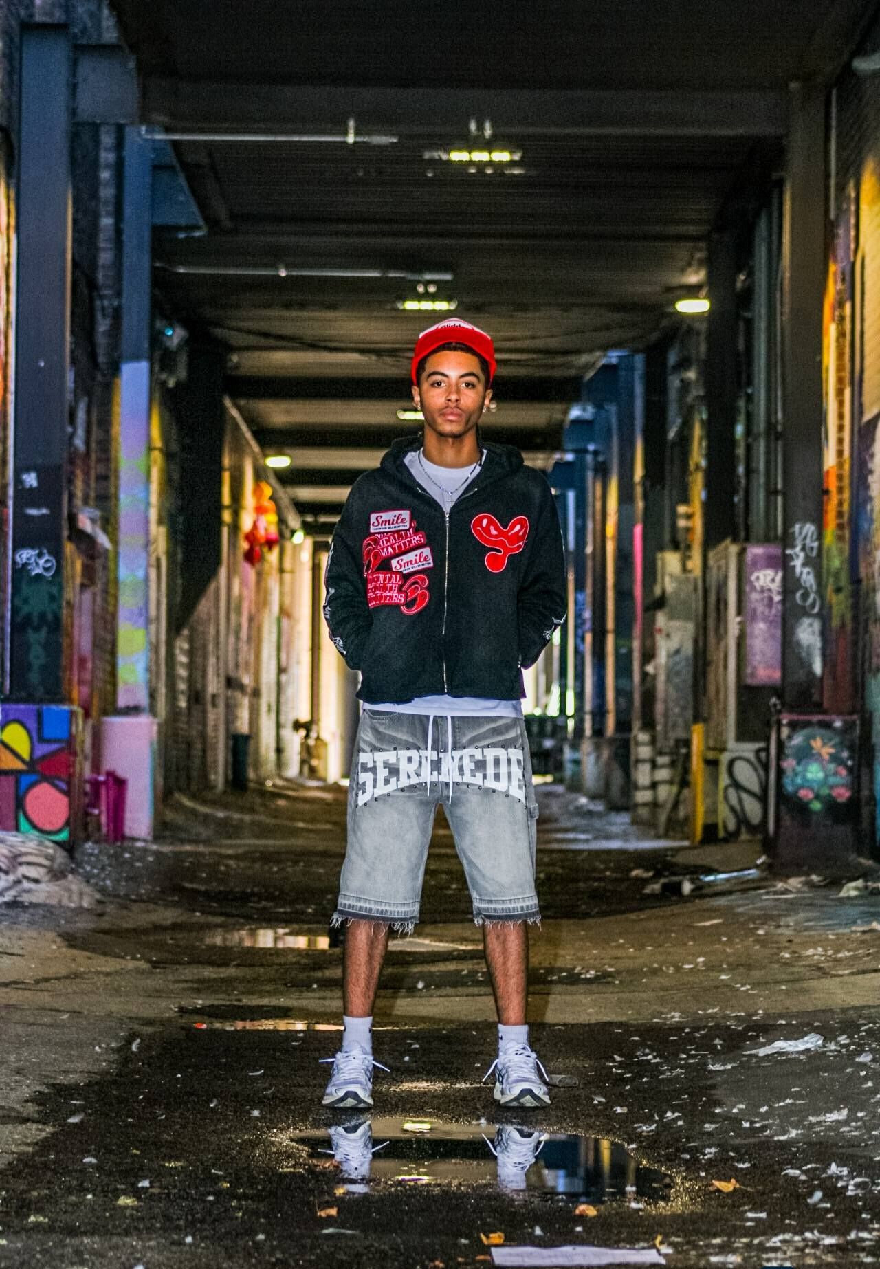 Senior portrait of male posing in rural area of downtown Sioux City, Iowa