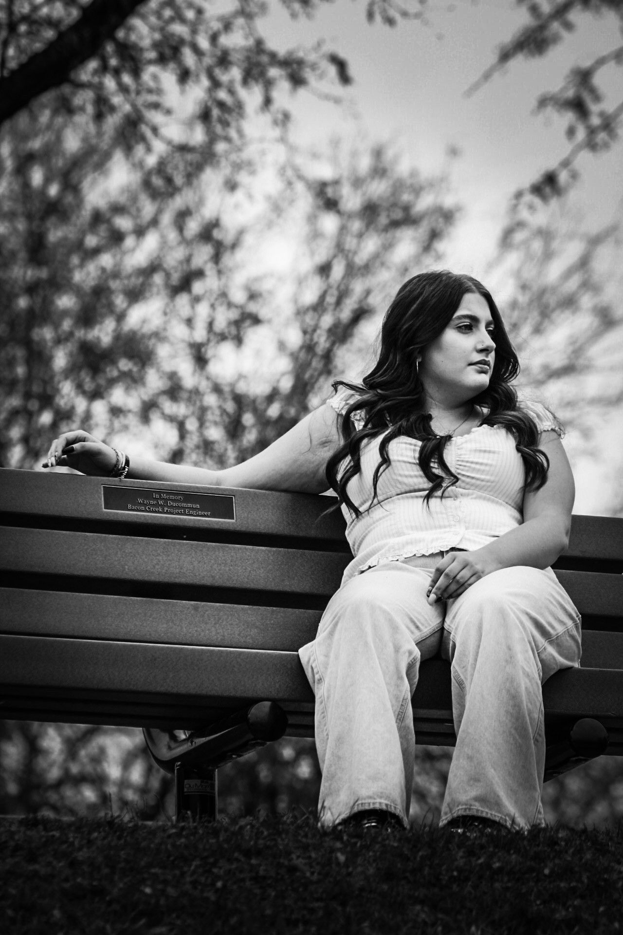 Senior portrait of female posing on park bench, Bacon Creek, Sioux City, Iowa