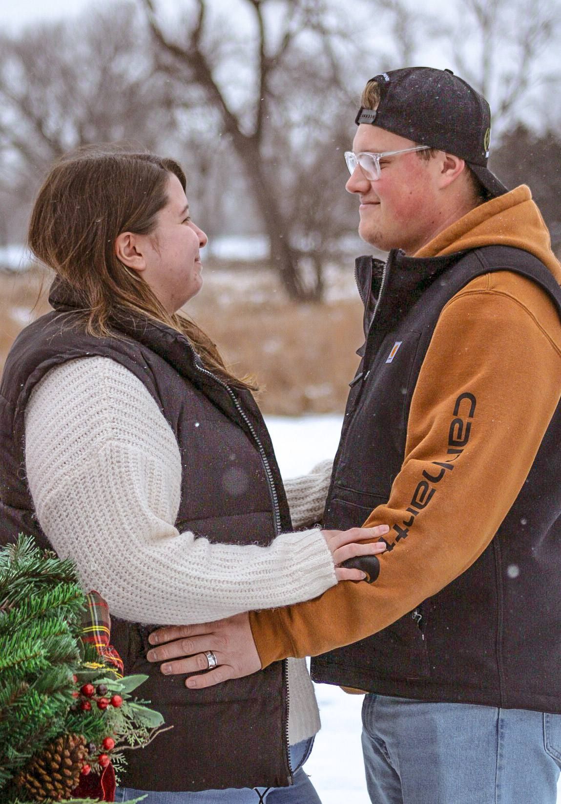 Couple posing by display truck, Adams Homestead, North Sioux City, South Dakota