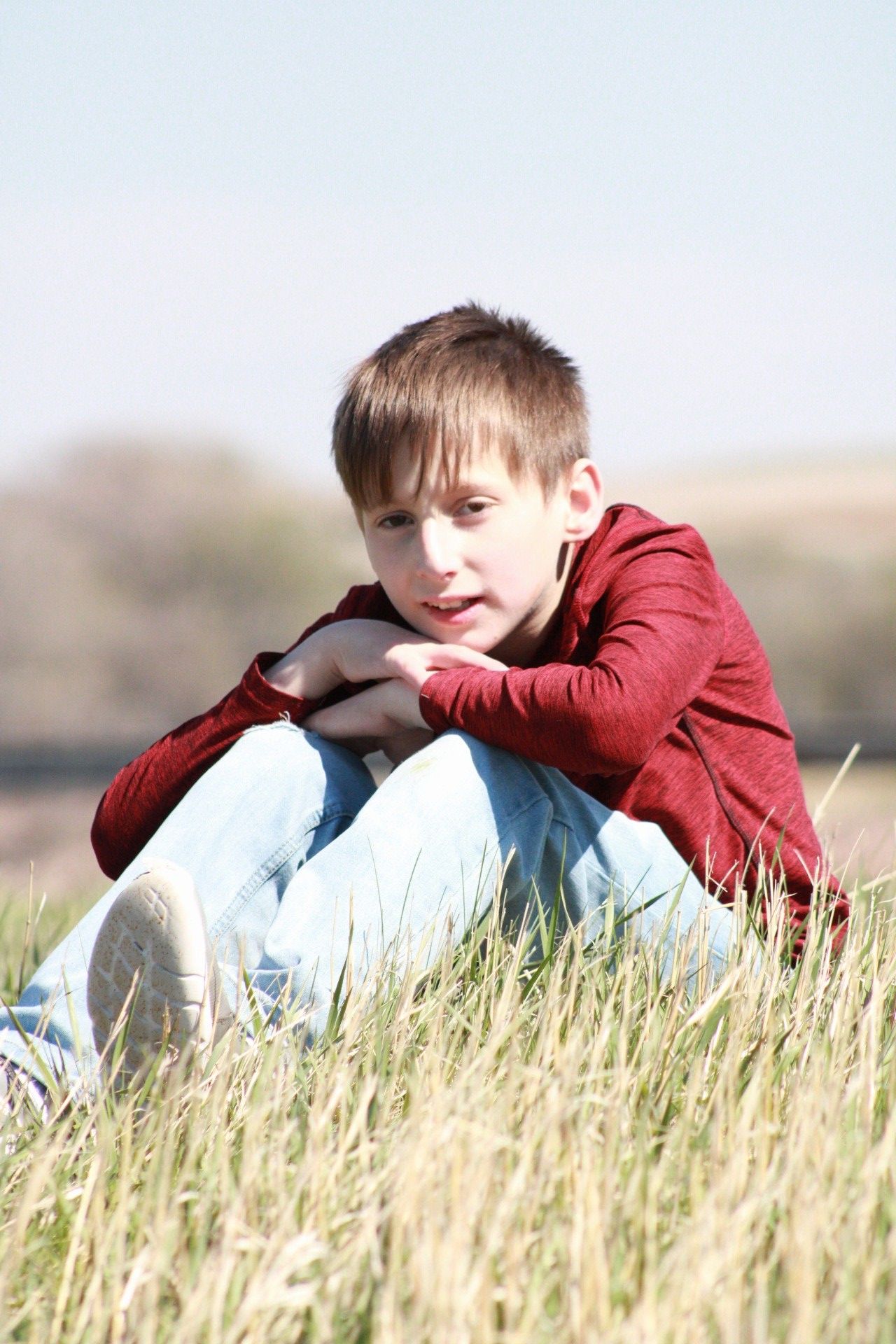 Portrait of male posing on grassy hill, Sioux City, Iowa
