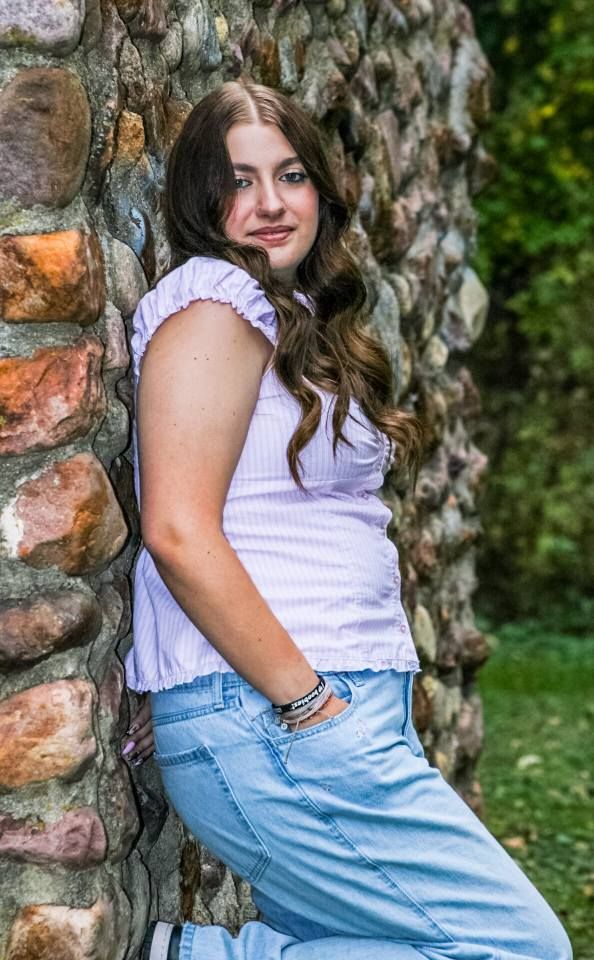 Senior portrait of female by stone wall, Stone State Park, Sioux City, Iowa