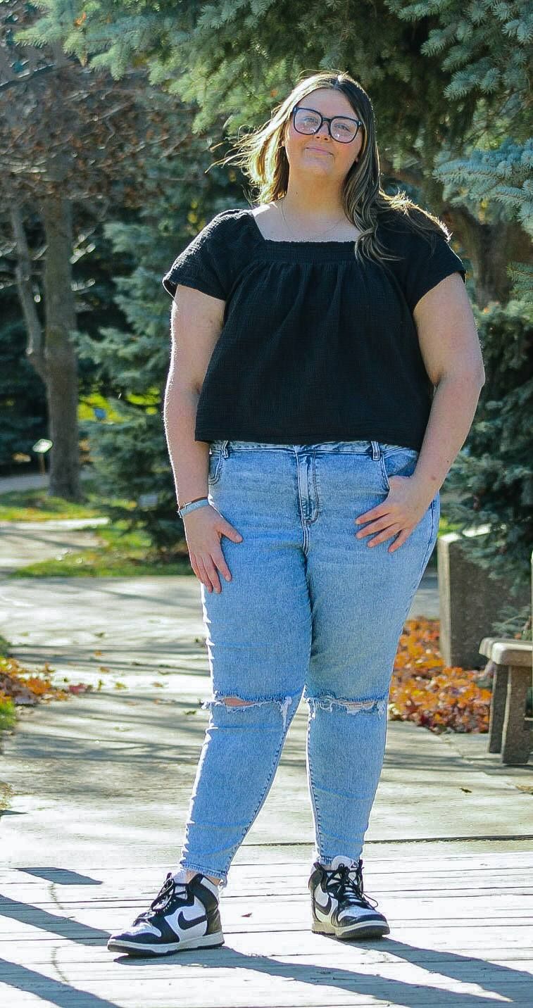 Trinity Heights, Sioux City, Iowa, fall Senior portrait along pathway
