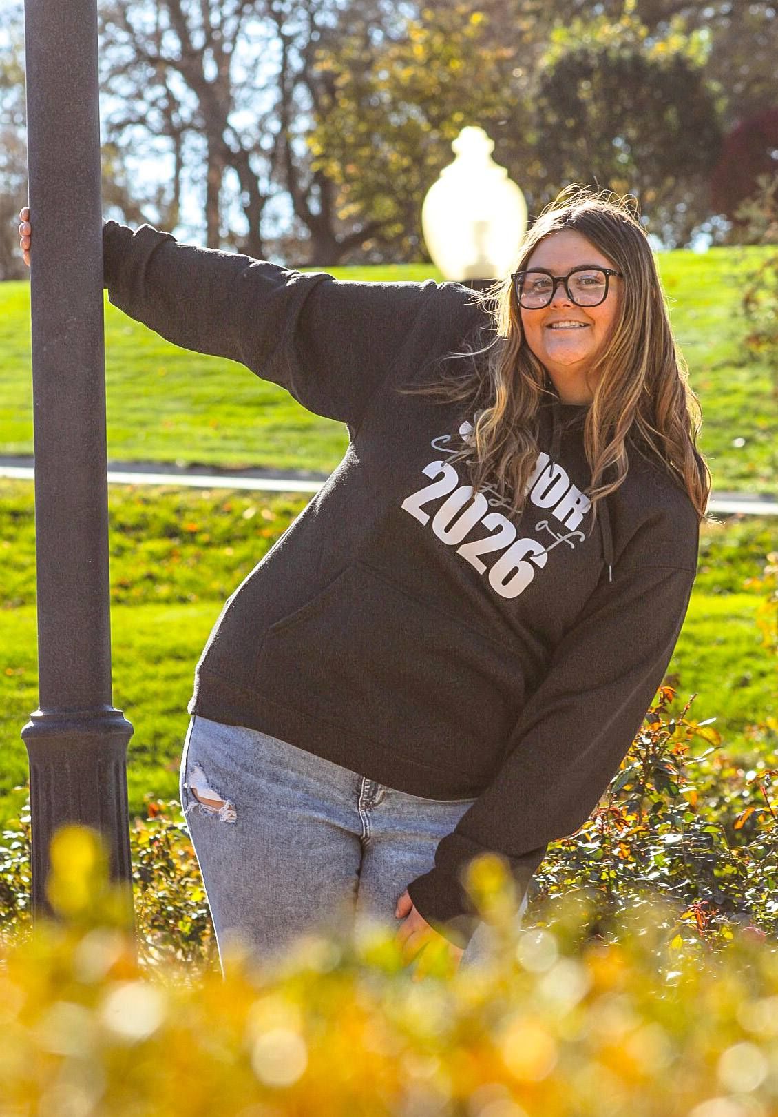Senior portrait of female by light pole, at Grandview Park, Sioux City, Iowa
