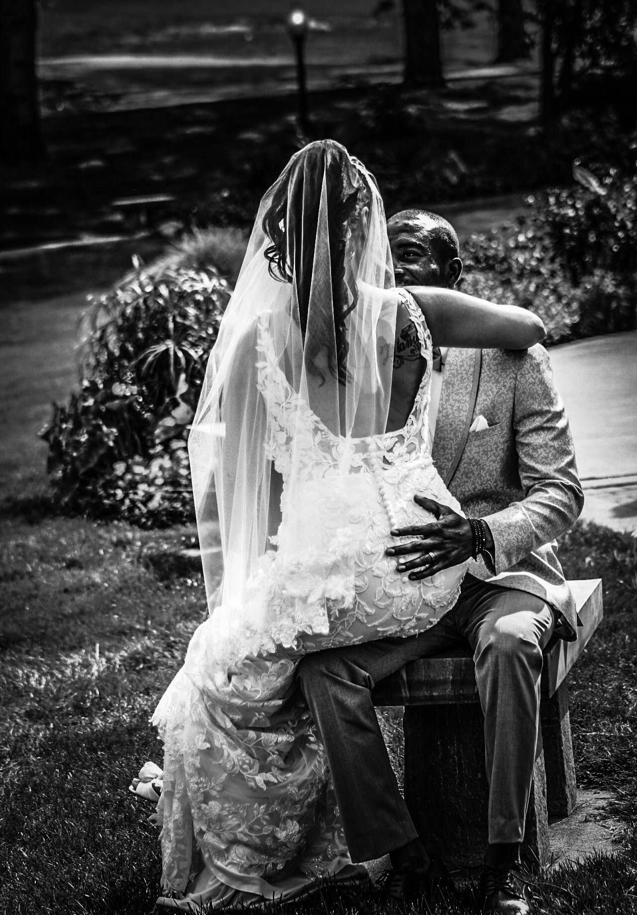 Wedding portrait of couple on bench, Rose Garden, Grandview Park, Sioux City, Iowa