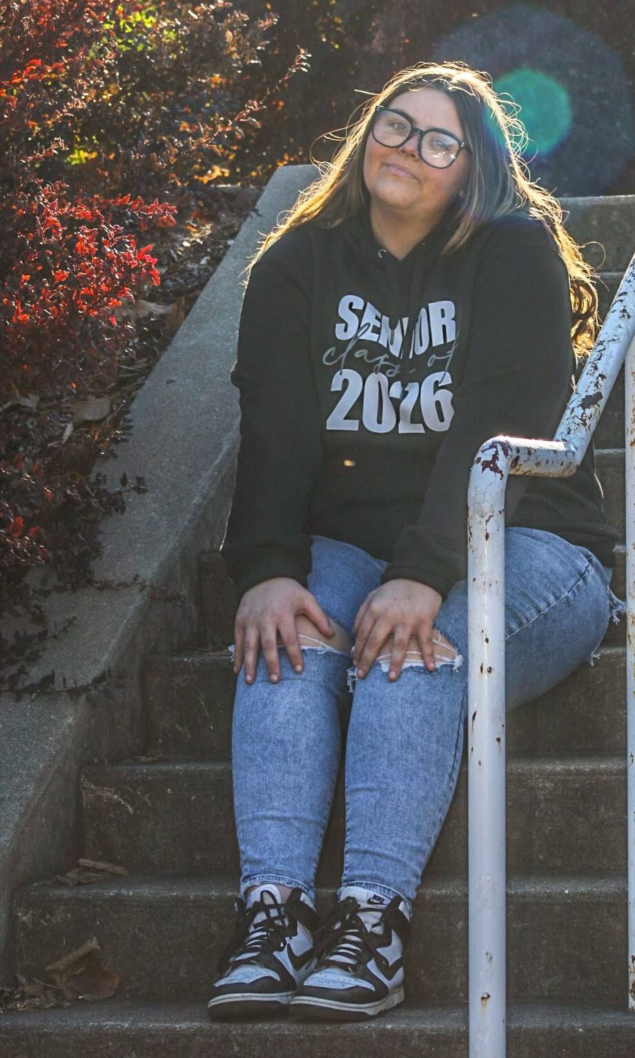 Senior portrait of female on steps in Grandview Park, Sioux City, Iowa