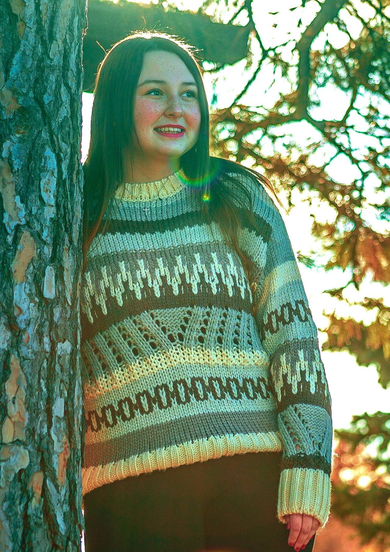 Senior portrait of female posing by tree, Browns Lake, Salix, Iowa
