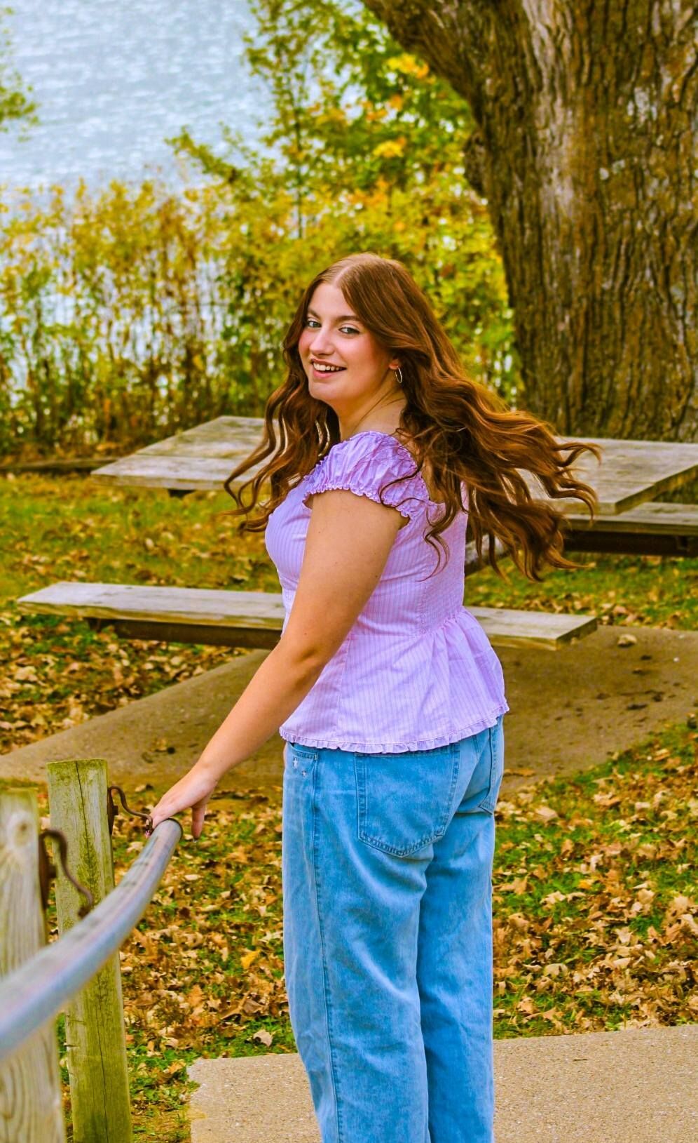 Senior portrait of female posing by stairs, Bacon Creek Park, Sioux City, Iowa