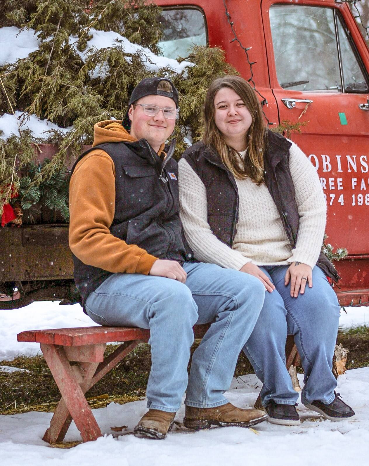 Couple posing by display truck, Adams Homestead, North Sioux City, South Dakota