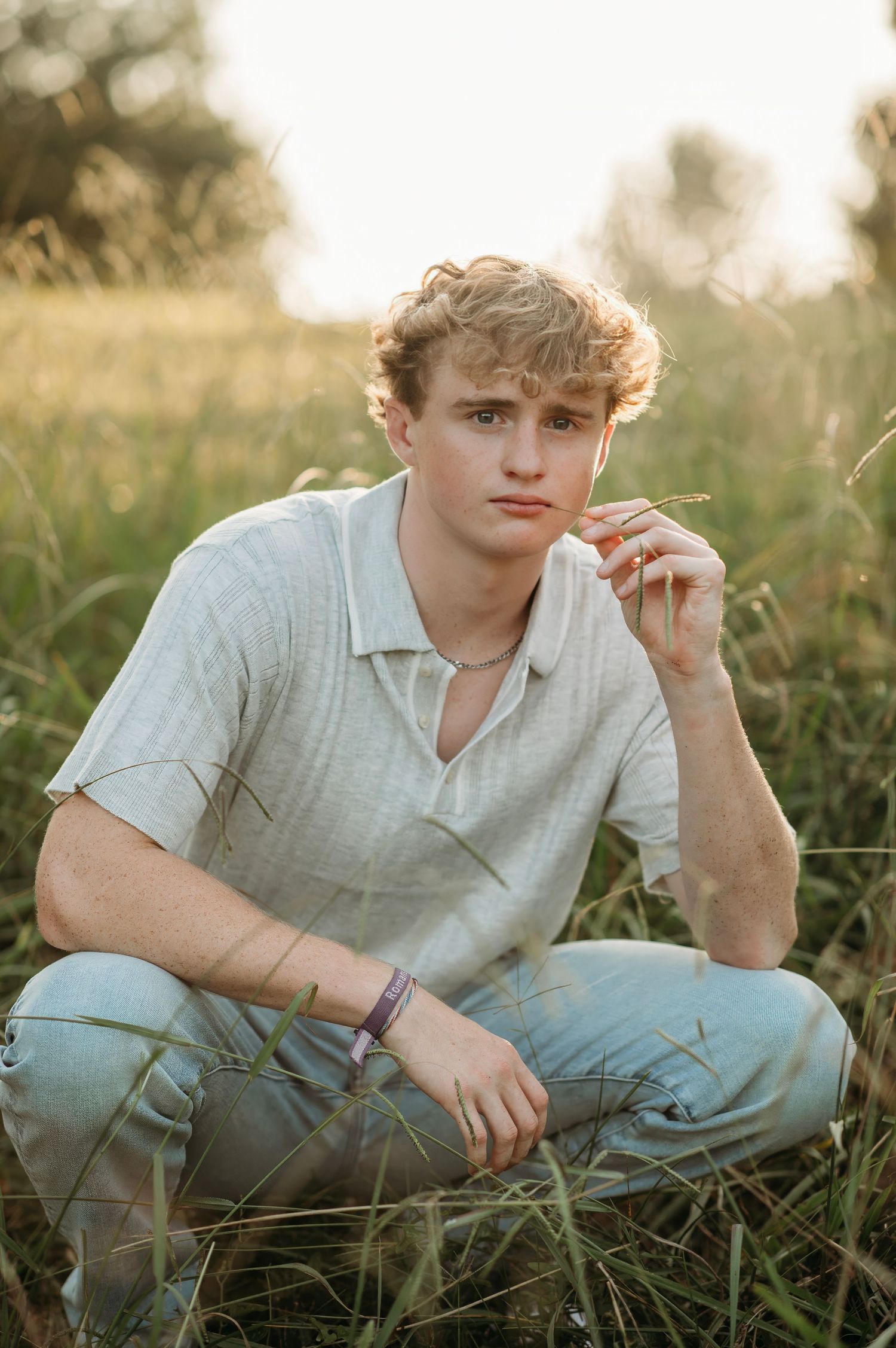 Casual outdoor portrait series in golden sunlight with someone lying in grass.