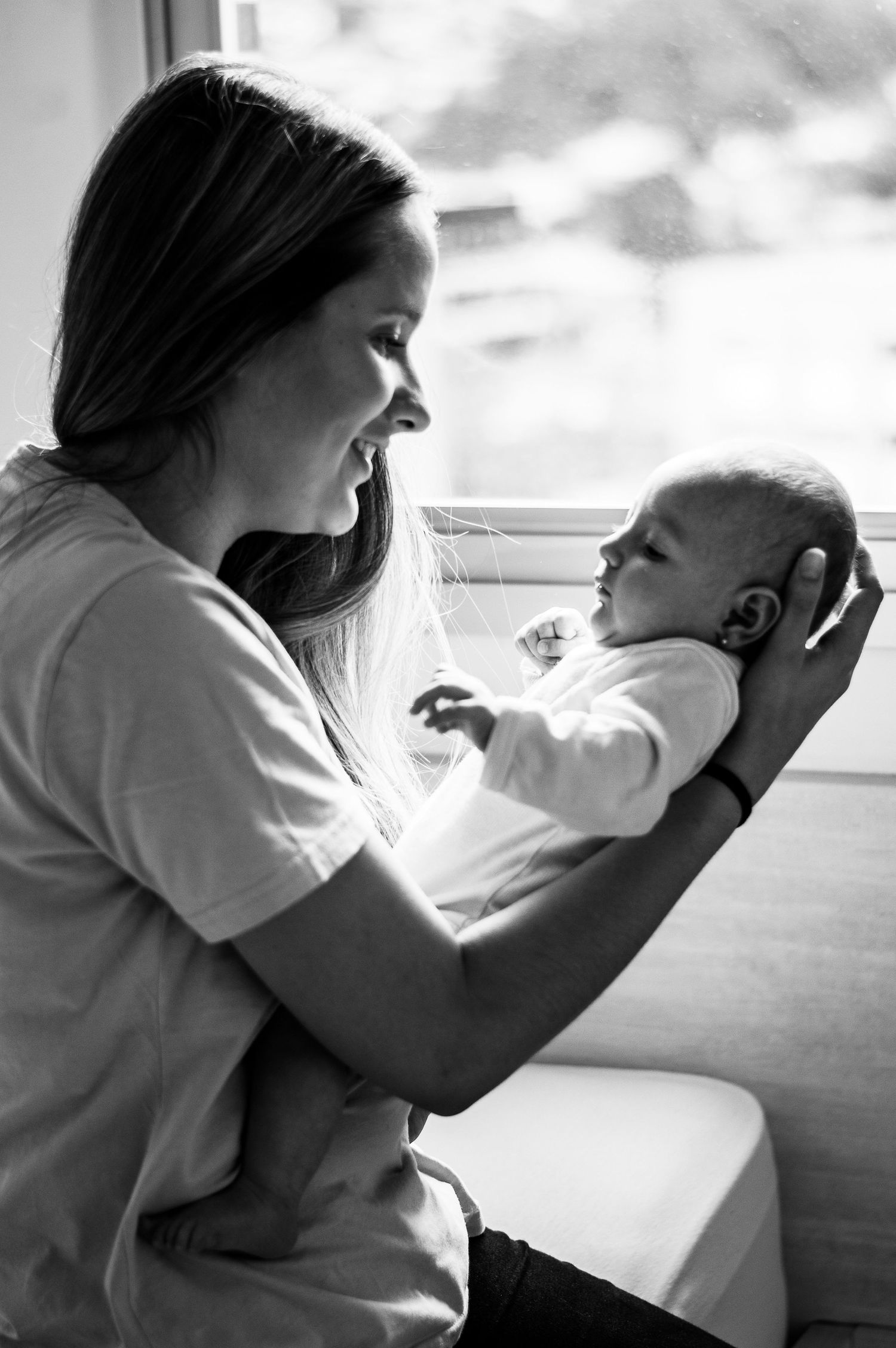 Black and white series showing tender moments between parent and child.
