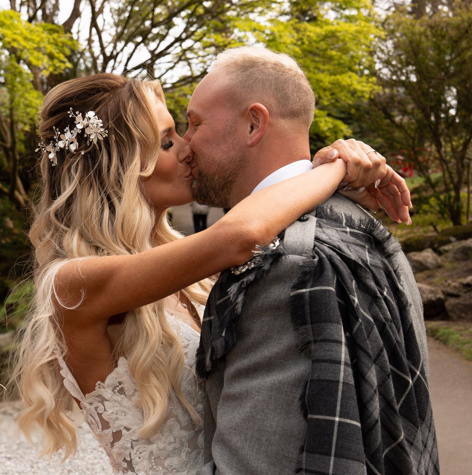 Intimate wedding portraits in a lush garden setting.