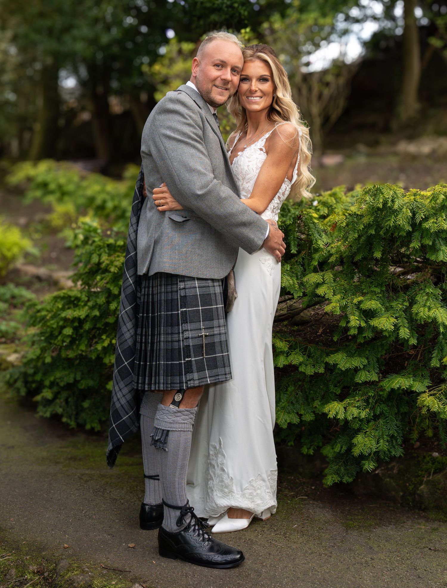 Scottish wedding photos capturing candid moments in garden setting.