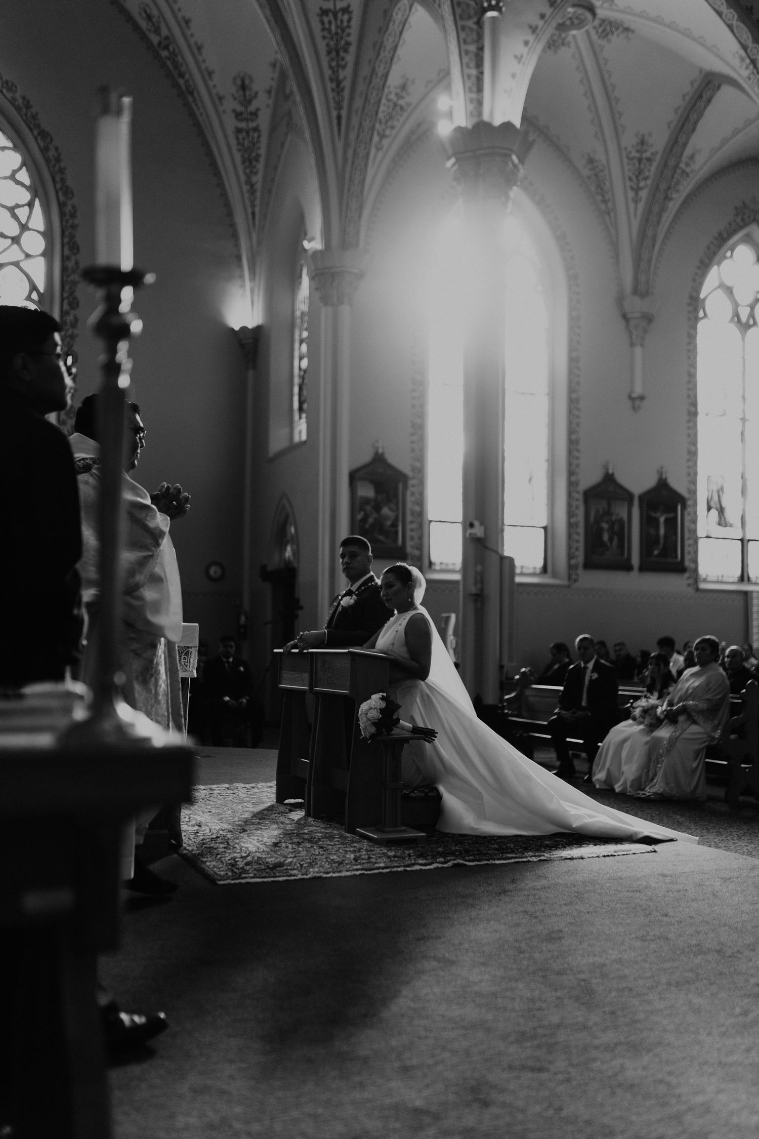 Black and white wedding photo inside Mount Angel Abbey Church in Oregon, captured by local wedding photographer during a wedding