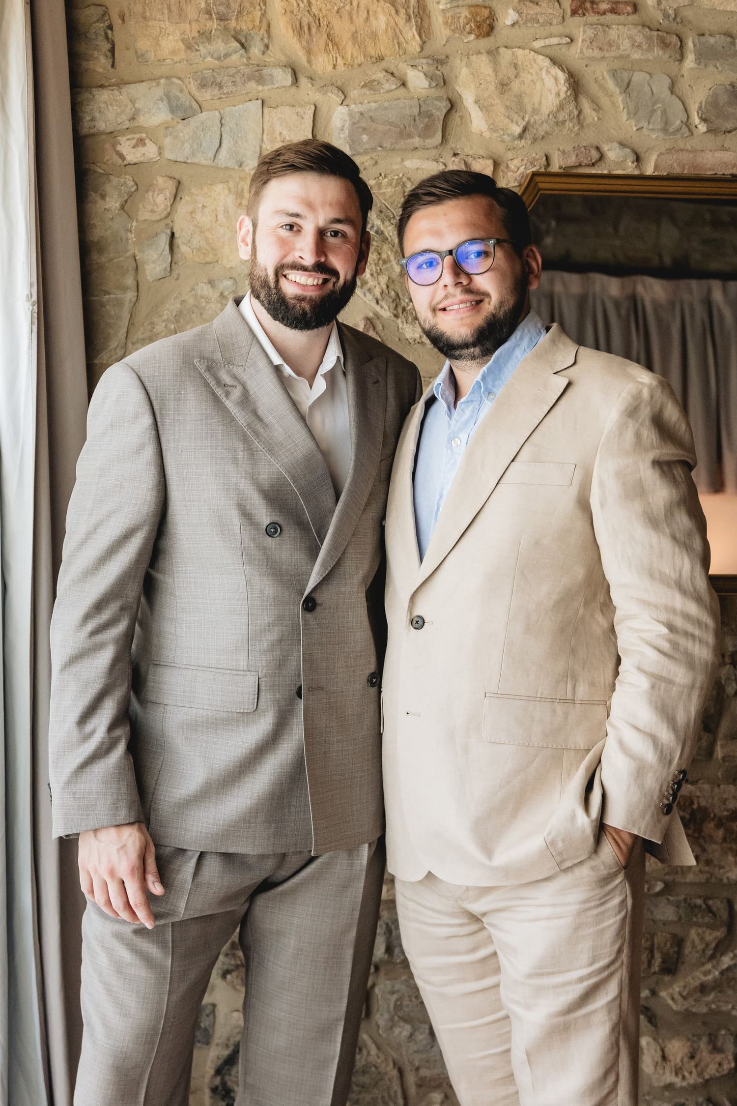 The groom with a friend before the vow exchange at Villa Le Bolli, Tuscany