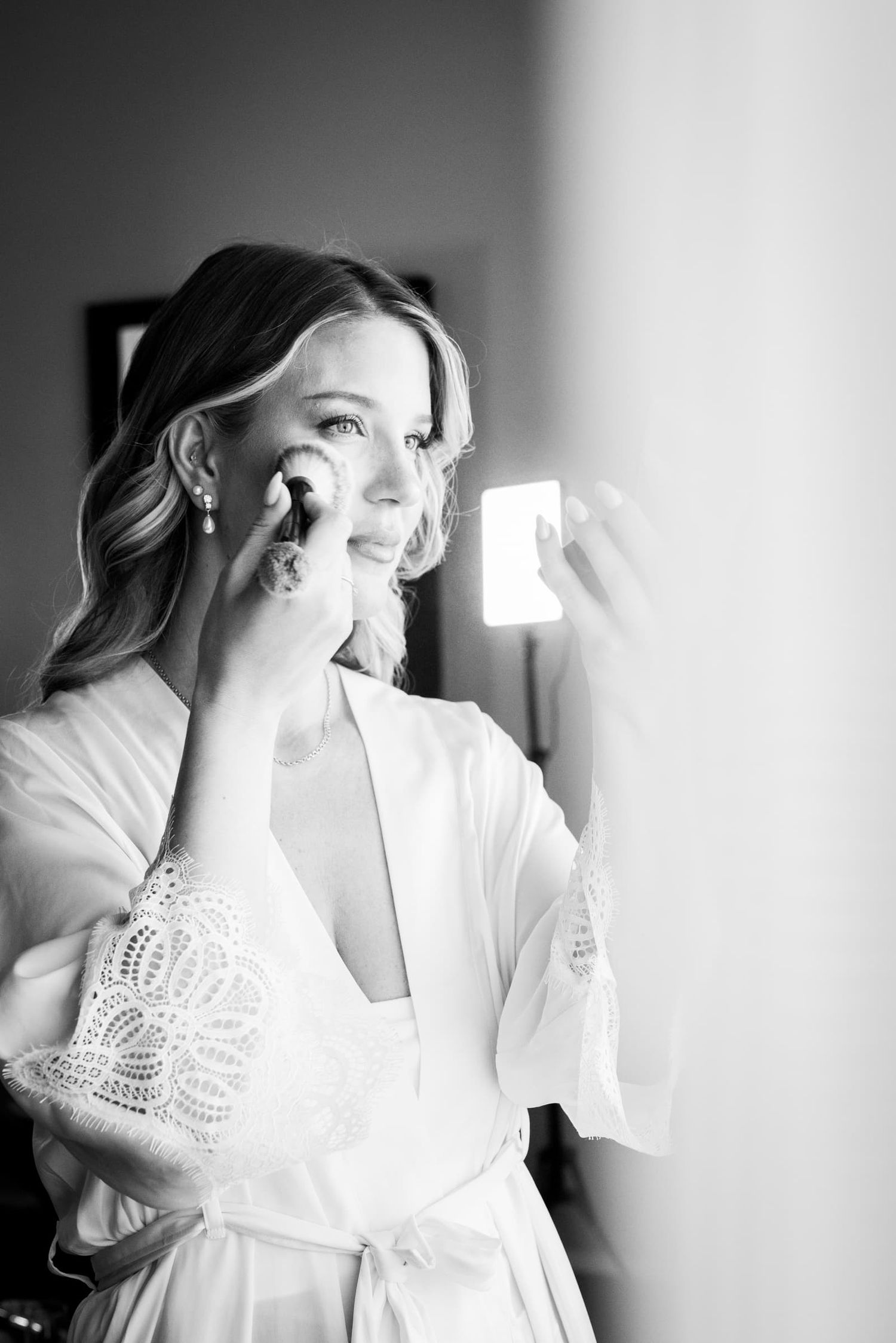 The bride applying her make-up by the window, black and white, Borgo San Faustino, Orvieto