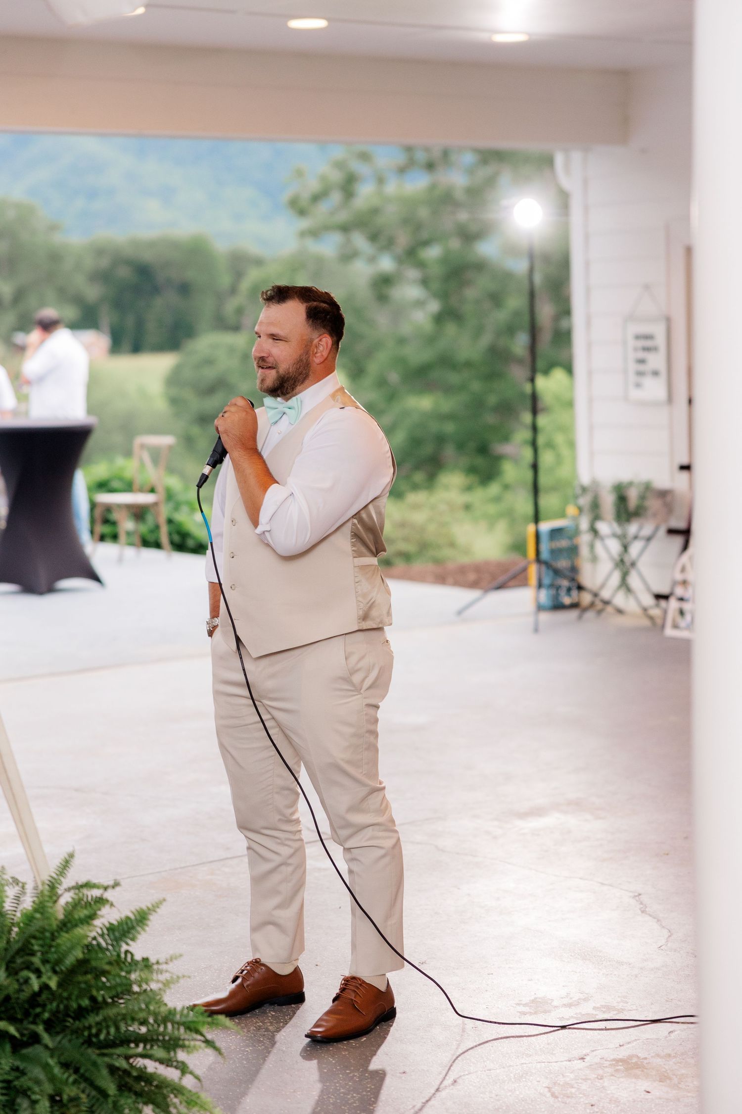 A series of photos showing a person in a light colored suit and brown shoes dancing on an outdoor patio.