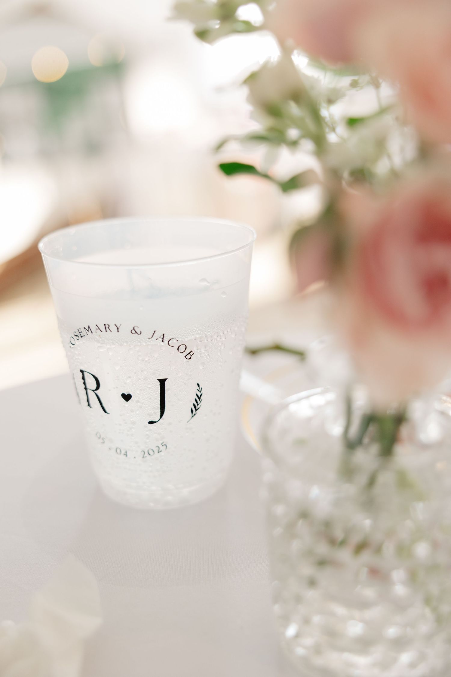 Personalized frosted wedding cup with monogram R+J and date details.