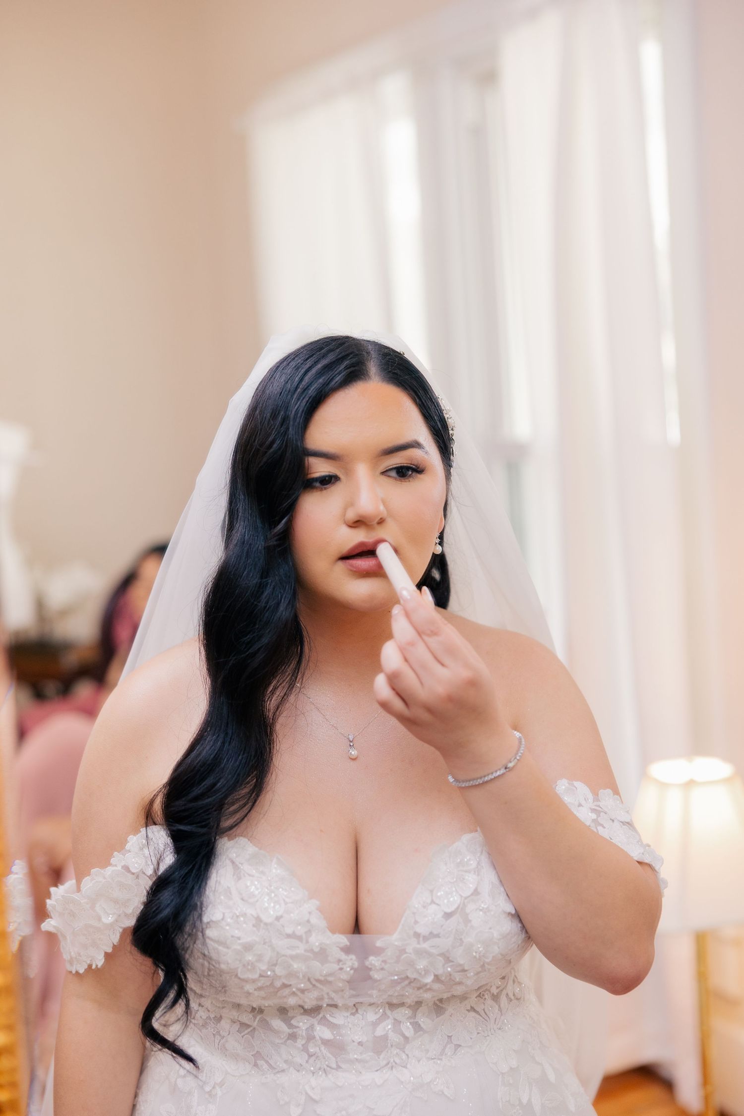 A beautiful white lace wedding dress shown in a series of detail shots.