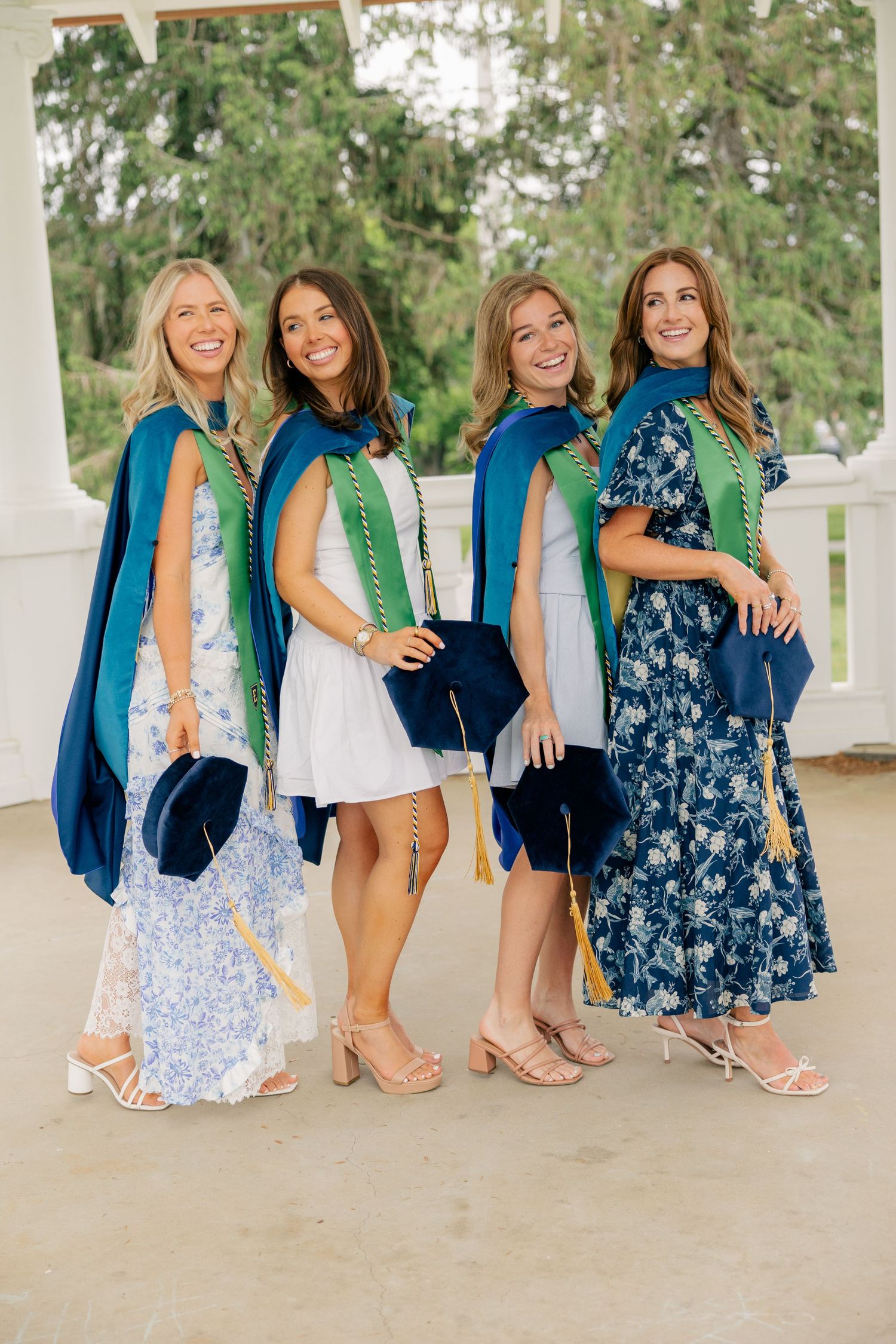 A series of four casual portrait shots showing friends sitting on white porch steps in blue and floral dresses.