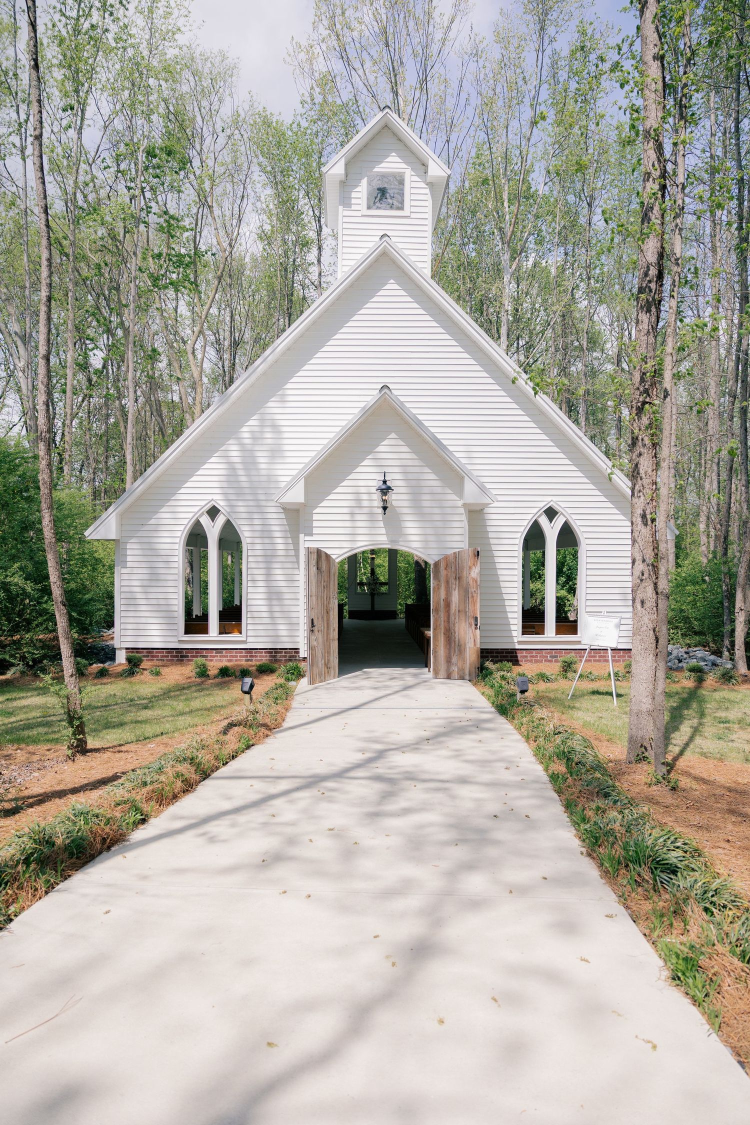 Sequence of photos showing a white wedding chapel surrounded by trees from different angles and distances.