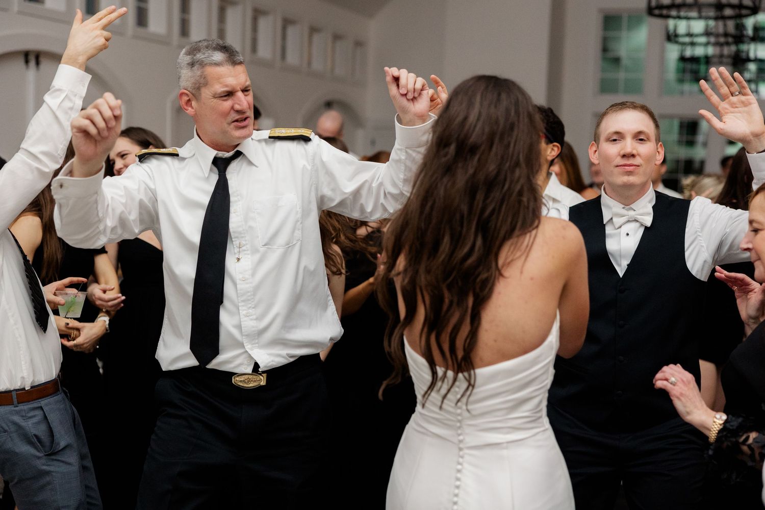 Wedding reception dance party sequence with people dancing and celebrating.