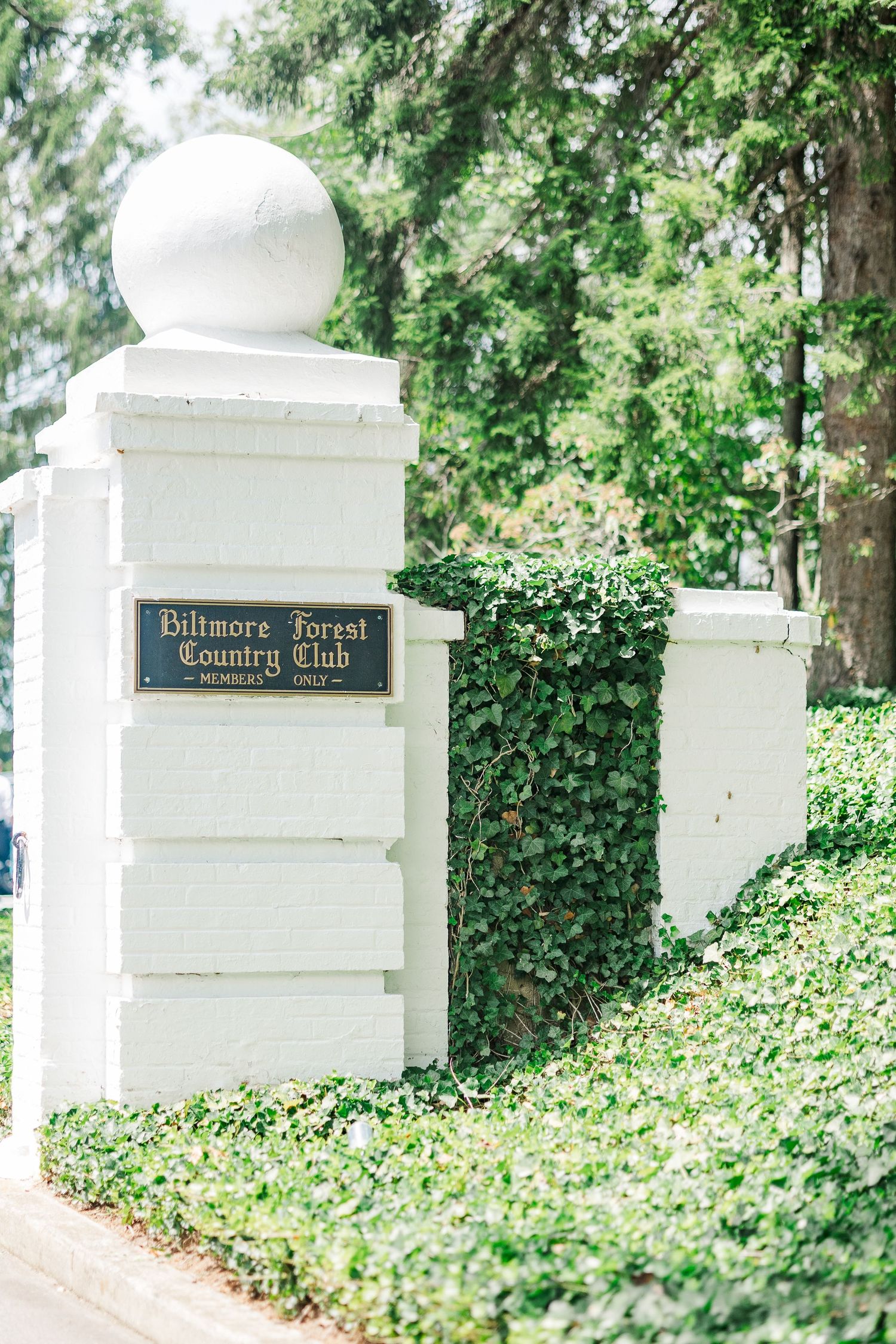 White stone entrance pillars with ivy at the Biltmore Forest Country Club.