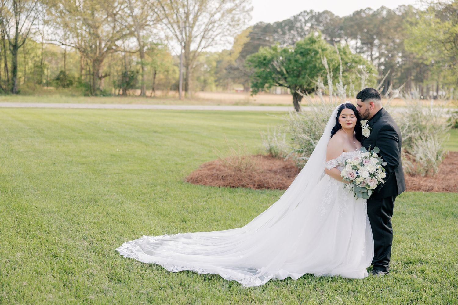 Wedding couple shares intimate moments during their outdoor photo session.
