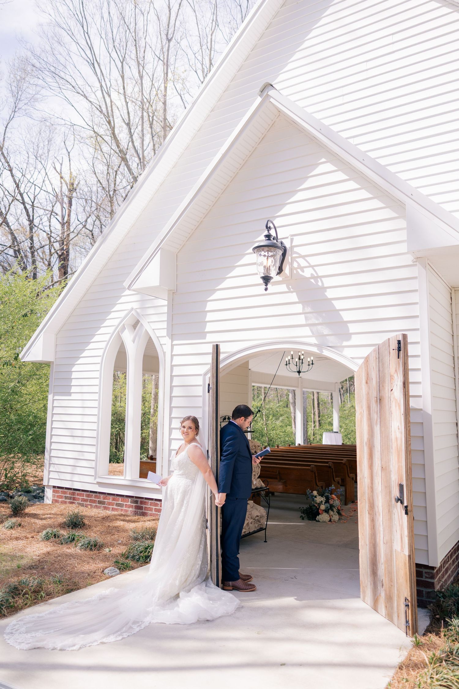 A series of first look photos at a white chapel showing emotional moments between the wedding couple.