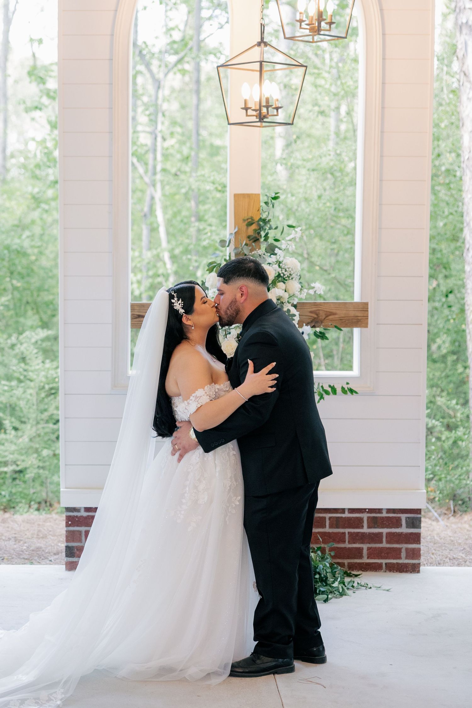 A romantic series of wedding portraits showing a couple in formal attire sharing intimate moments under an elegant covered porch.