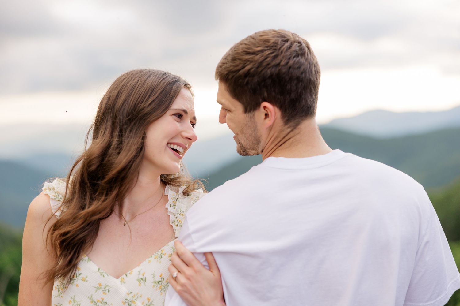 A couple shares intimate moments during their mountain wedding photoshoot in a series of romantic poses.