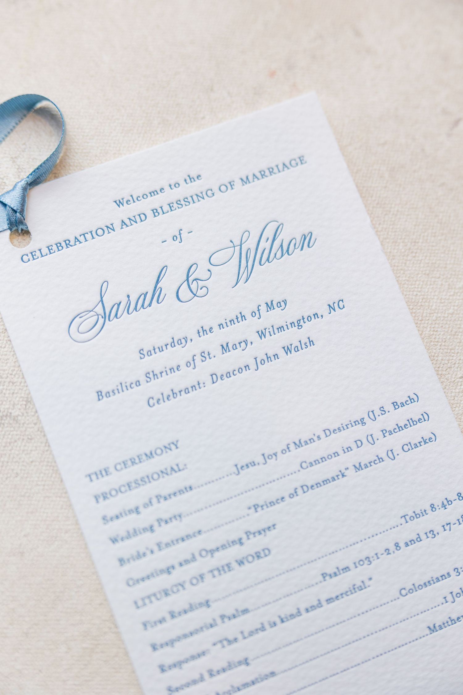 Elegant blue and white wedding program for Sarah and Wilson's ceremony in Wilmington, NC, May 9.